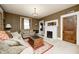 Cozy living room with a decorative fireplace, a comfortable sofa, and soft lighting at 114 E Mill St, Brooklyn, IN 46111