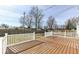 Spacious wooden deck with white railing, perfect for outdoor entertaining and relaxation at 117 W Mckenzie Rd, Greenfield, IN 46140