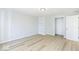Bright bedroom with hardwood floors, large closet, and adjacent room at 117 W Mckenzie Rd, Greenfield, IN 46140