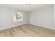 Bedroom with hardwood flooring, and a window providing view and natural light at 117 W Mckenzie Rd, Greenfield, IN 46140