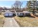 Attractive single-story home with a two-car garage, classic design and well-maintained lawn at 117 W Mckenzie Rd, Greenfield, IN 46140