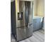 Modern kitchen featuring a stainless steel Samsung refrigerator and light gray cabinetry at 117 W Mckenzie Rd, Greenfield, IN 46140