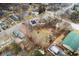 Aerial view of a property with a large backyard surrounded by trees, marked by a red line at 122 S Green St, Brownsburg, IN 46112