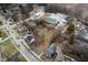 Aerial view of a home surrounded by mature trees in a neighborhood setting at 122 S Green St, Brownsburg, IN 46112