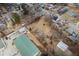 Aerial view of a property with a large backyard surrounded by industrial buildings at 122 S Green St, Brownsburg, IN 46112