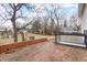 Brick patio and backyard with mature trees at 122 S Green St, Brownsburg, IN 46112