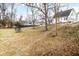 Spacious backyard with a trampoline and lush greenery at 122 S Green St, Brownsburg, IN 46112