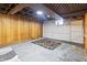 Unfinished basement featuring paneled walls and exposed ceiling at 122 S Green St, Brownsburg, IN 46112