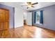 Well-lit bedroom featuring beautiful hardwood floors and a large window with a view at 122 S Green St, Brownsburg, IN 46112