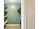 Walk-in closet with built-in shelves and a sliding barn door at 122 S Green St, Brownsburg, IN 46112