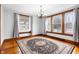 Charming dining room features hardwood floors, a chandelier, and natural light at 122 S Green St, Brownsburg, IN 46112