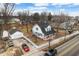 Charming two-story home featuring a gambrel roof, white siding, blue shutters, and a well-manicured lawn at 122 S Green St, Brownsburg, IN 46112