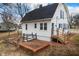 Exterior side view of a charming home, complete with a small brick patio and manicured backyard at 122 S Green St, Brownsburg, IN 46112