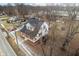 Aerial view of a charming two-story home with a gambrel roof and a white picket fence at 122 S Green St, Brownsburg, IN 46112