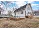 Charming two-story home with a brick foundation and a bright blue front door at 122 S Green St, Brownsburg, IN 46112
