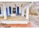 Charming front porch with a classic Coca-Cola swing, offering a cozy outdoor space at 122 S Green St, Brownsburg, IN 46112