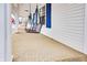 A spacious front porch featuring a stylish Coca-Cola swing, ideal for outdoor relaxation at 122 S Green St, Brownsburg, IN 46112