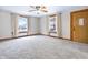 Bright, carpeted living room with natural light, featuring a cozy and inviting atmosphere at 122 S Green St, Brownsburg, IN 46112