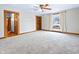 Bright, airy living room with plush carpet, built-in shelves and detailed wood trim around a large window at 122 S Green St, Brownsburg, IN 46112