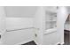 Unfinished storage area in attic with carpeted floor, cubby storage and built-in shelving at 12404 Doe Ln, Indianapolis, IN 46236