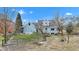 The backyard showcases a well-kept lawn, wood fencing, and an inviting outdoor space for relaxation at 12404 Doe Ln, Indianapolis, IN 46236