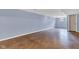 Large basement area with painted blue walls, shiny concrete floor, a window and door at 12404 Doe Ln, Indianapolis, IN 46236