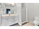 Updated bathroom featuring modern vanity with sink, a glass enclosed shower, and tiled flooring at 12404 Doe Ln, Indianapolis, IN 46236