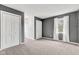 Spacious bedroom featuring neutral carpet, complemented by natural light streaming through the window at 12404 Doe Ln, Indianapolis, IN 46236