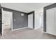 Bedroom featuring neutral walls and carpet, with a chandelier adding a touch of elegance at 12404 Doe Ln, Indianapolis, IN 46236