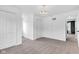 Bright bedroom featuring neutral carpet, overhead light fixture, and closet with double doors at 12404 Doe Ln, Indianapolis, IN 46236