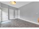 Spacious entryway featuring gray tile flooring and multiple white doors, offering a welcoming entrance at 12404 Doe Ln, Indianapolis, IN 46236