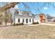 Beautiful home featuring a well-maintained lawn and mature trees, showcasing the property's charm at 12404 Doe Ln, Indianapolis, IN 46236