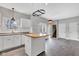 Bright kitchen with stainless steel appliances, an island, and tiled floors at 12404 Doe Ln, Indianapolis, IN 46236