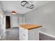 Kitchen island with butcher block top and additional storage in a bright kitchen at 12404 Doe Ln, Indianapolis, IN 46236