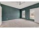 Spacious primary bedroom with soft neutral carpet, modern ceiling fan and bright walls at 12404 Doe Ln, Indianapolis, IN 46236
