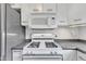 Kitchen featuring stove, oven, microwave and white cabinets at 12404 Doe Ln, Indianapolis, IN 46236