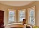 Charming bay window with bench seat, offering natural light and a cozy space to relax and enjoy the view at 1300 W University Ave, Muncie, IN 47303
