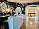 Elegant entryway with a marble reception desk, piano, and decorative wallpaper at 1300 W University Ave, Muncie, IN 47303