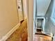 Hallway features hardwood floors, trim details, and access to staircase at 1300 W University Ave, Muncie, IN 47303