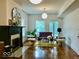 Bright living room features hardwood floors, fireplace, and a comfortable seating arrangement at 1300 W University Ave, Muncie, IN 47303