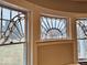 Detailed windows showcase unique architectural design, adding character and charm to the home's interior at 1300 W University Ave, Muncie, IN 47303