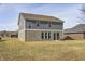 Back exterior view of home with manicured lawn at 13115 N Departure W Blvd, Camby, IN 46113