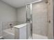 Contemporary bathroom with a soaking tub and a separate tiled shower with glass door at 13115 N Departure W Blvd, Camby, IN 46113
