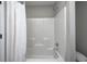 Standard shower and bathtub combination with a shower curtain at 13115 N Departure W Blvd, Camby, IN 46113