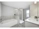 Modern bathroom with double sinks, large soaking tub, and separate glass shower at 13115 N Departure W Blvd, Camby, IN 46113
