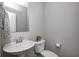 Cozy powder room features a pedestal sink and classic toilet at 13115 N Departure W Blvd, Camby, IN 46113