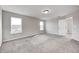 Bright, open bedroom with plush carpeting and natural light from two windows at 13115 N Departure W Blvd, Camby, IN 46113