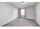 Neutral bedroom with carpet, closet and window with light pink curtains at 13115 N Departure W Blvd, Camby, IN 46113