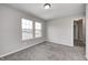 Bright bedroom with plush carpet, neutral paint, and double windows at 13115 N Departure W Blvd, Camby, IN 46113