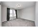 Bright bedroom featuring plush carpet, neutral paint, and well-lit window at 13115 N Departure W Blvd, Camby, IN 46113
